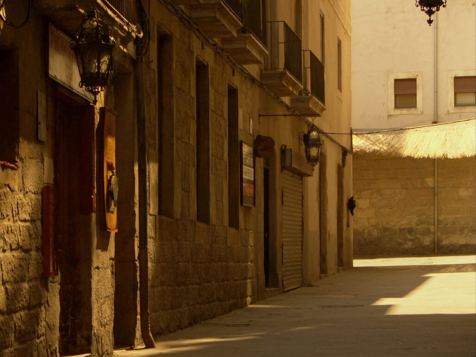 Narrow medieval stone street in Barcelona's Gothic Quarter