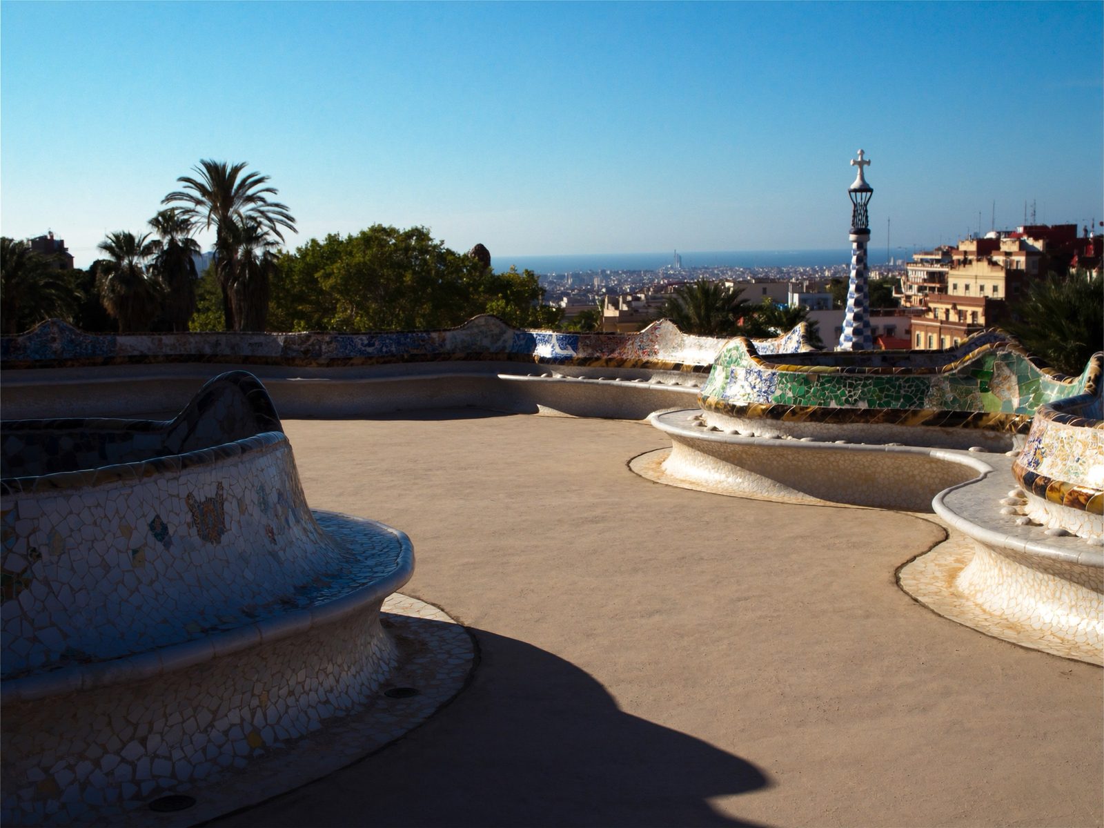 Colorful mosaic tile terrace at Park Güell overlooking Barcelona